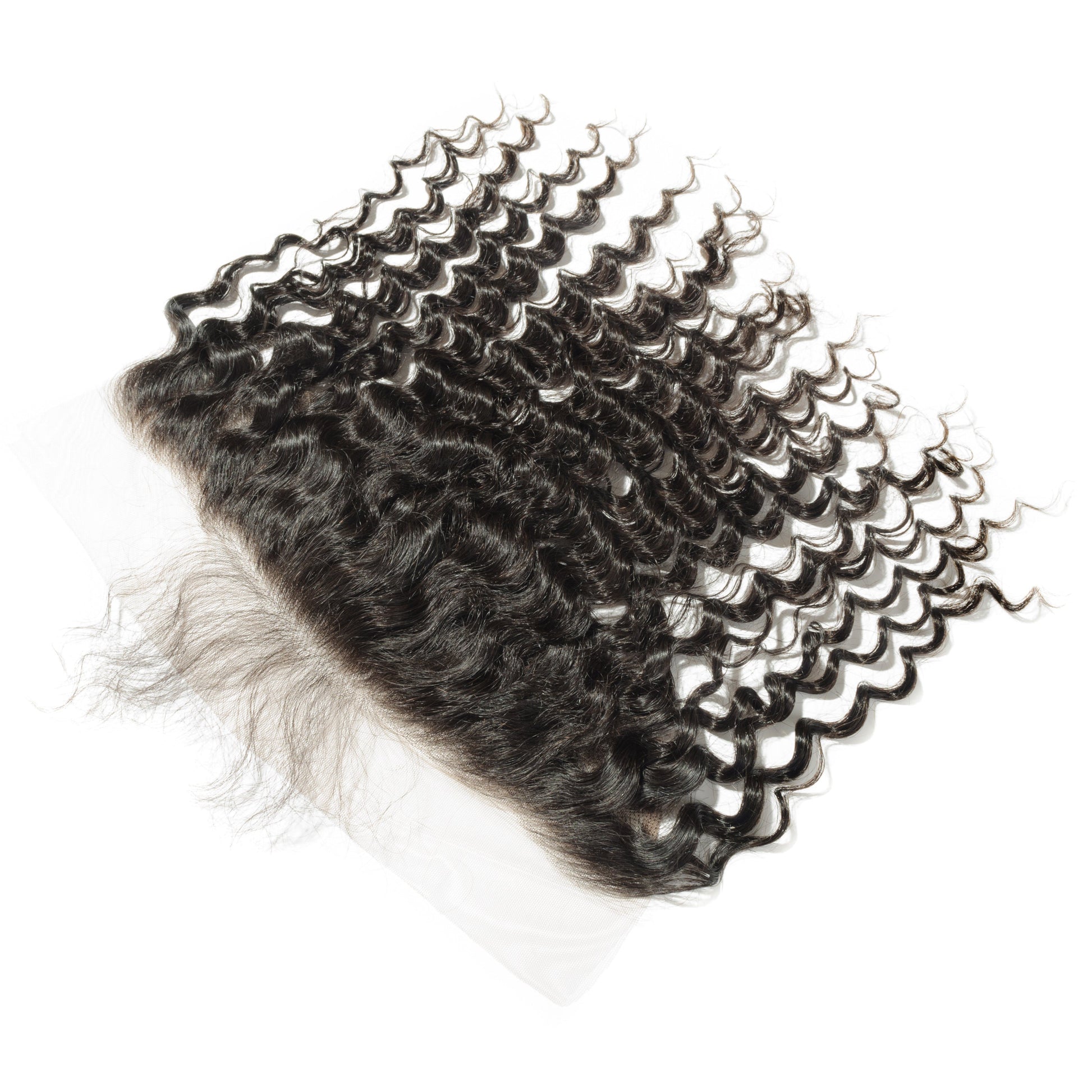 Set of curly hair extensions on a white background