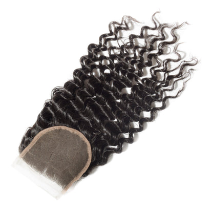 Curly hair extension with a lace closure on a white background