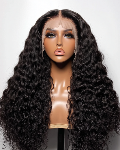 Black wig with deep curls on a mannequin head against a white background